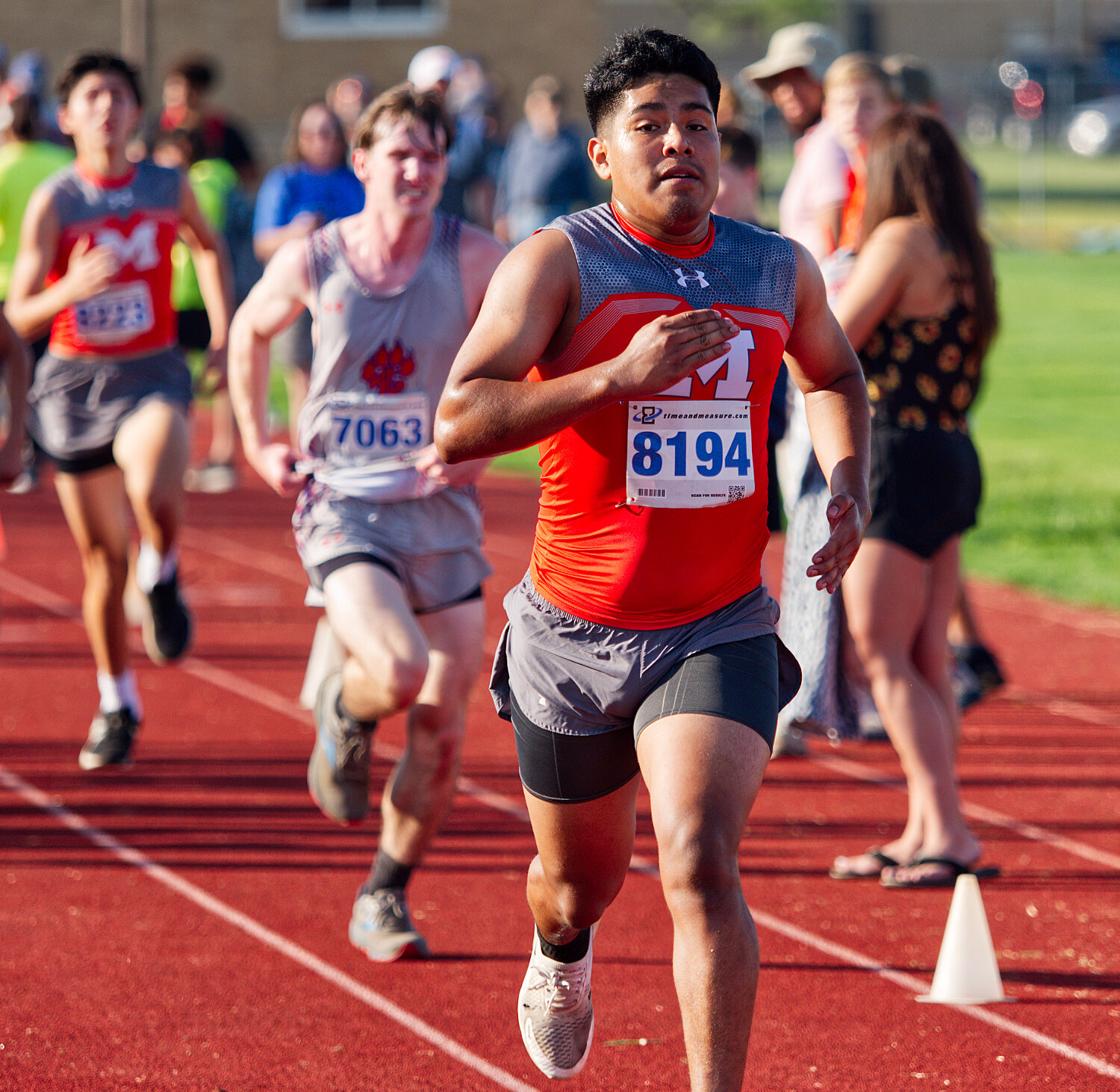 Mineola's Kaleb Silvereo approaches the finish line, followed closely by teammate Sebastian Klodnicki and Alba-Golden's Hudson Wright. [catch the cross-country competition]